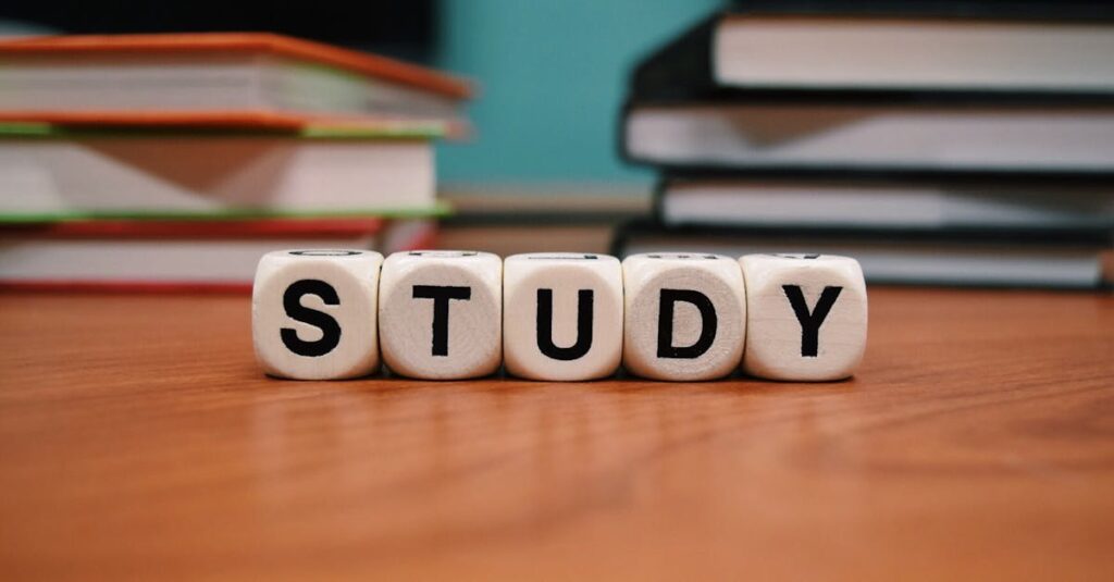 Close-up of study blocks and stacked books on a wooden desk, symbolizing education and learning.